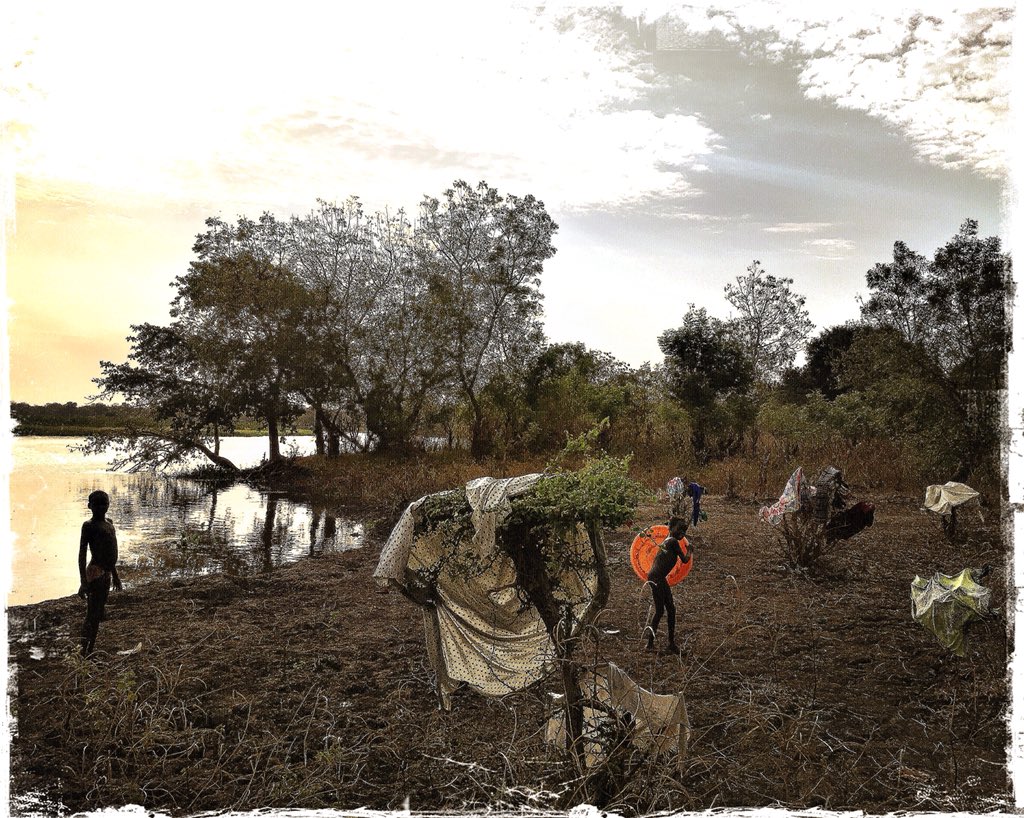 Sunset on Pibor river banks, Nuerland, opposition stronghold. Rainy season is over. Clothes &amp; roads are drying opening ways to offensive time.