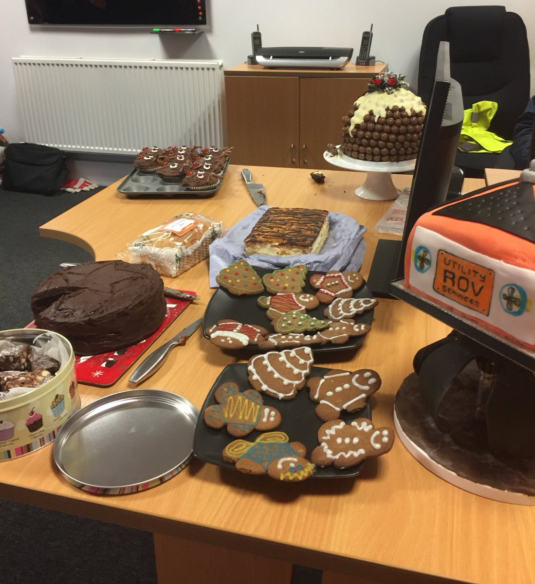 UtilityROV's tweet photo. It's our "Christmas Bake Off" today in the office. Great effort from all the team, including a #utrov cake! https://t.co/ehzxIvSEc1