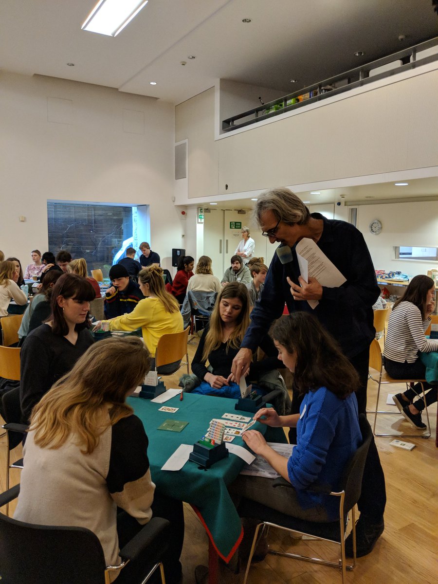 ARBC_Bridge's tweet photo. Andrew Robson teaching the first #bridge moves to 15 tables of 16-22 year olds in #Nottinghill https://t.co/nBIUSIeUyi