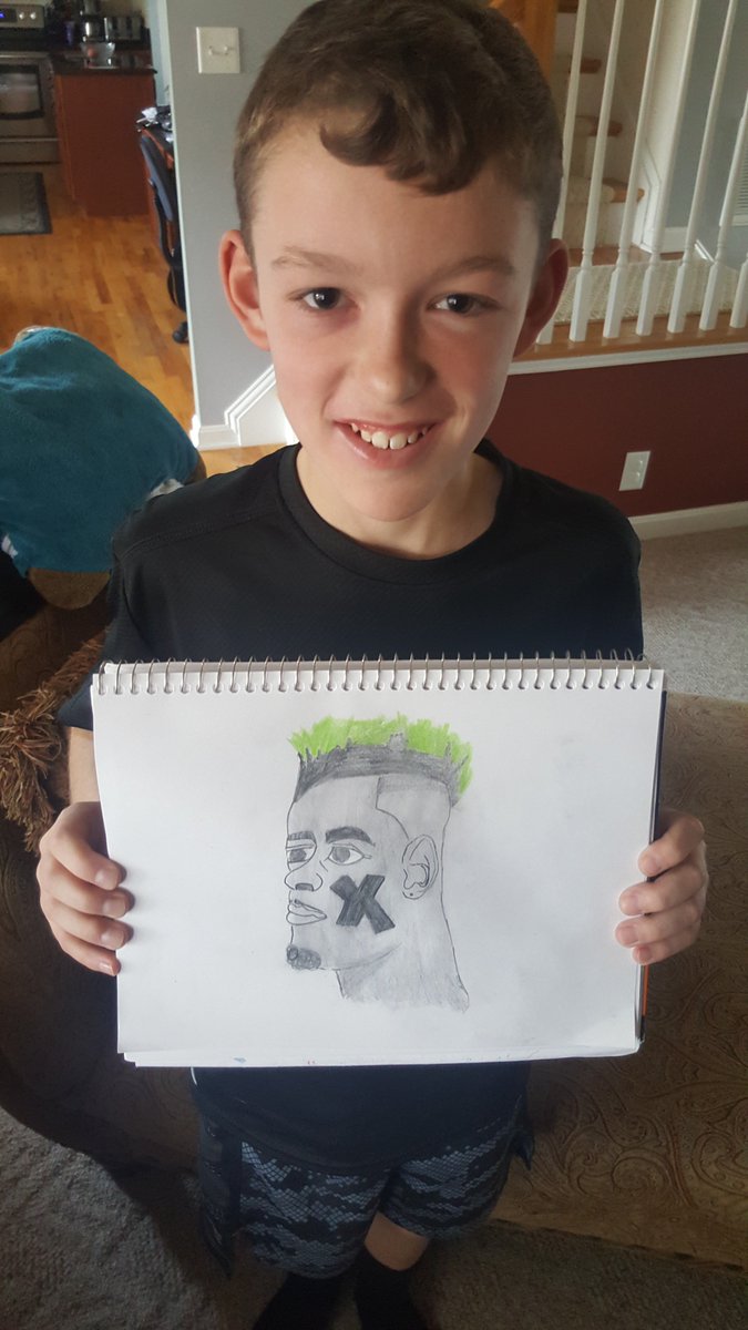 RunningDadBlog's tweet photo. @greengoblin My son Connor, 11, showing off his art skills and Eagle pride. https://t.co/Dc8KYVLiEx