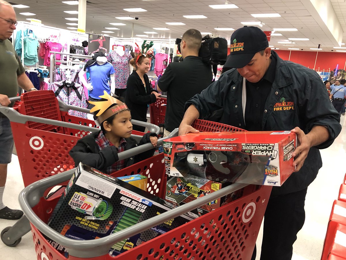 CityofMcAllen's tweet photo. Christmas came a little early this year for some @McAllenISD students. Thanks to @target, McAllen PD, McAllen Fire, @cbp and all of the amazing volunteers for making the Heroes and Helpers event a success. 
#McAllenProud https://t.co/u4swO54X5Q