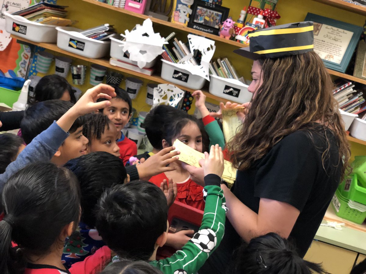 Caught <a href="/MrsMellaci/">Colleen Mellaci</a> disguised as a train conductor handing out ‘golden tickets’ to her class for Polar Express Day! #jmproud #edisonk12
