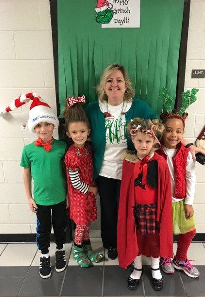mulberryes's tweet photo. Happy Grinch Day!  Mrs. Watkins, our assistant principal, is celebrating with some of our first graders. https://t.co/8W1zlcNRUf