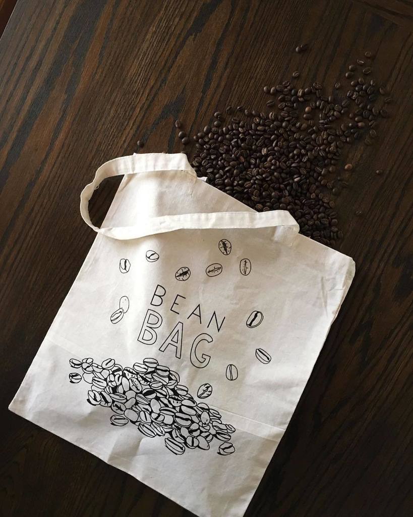 blindtigertampa's tweet photo. We're spilling the beans! @humdrumpaper x Blind Tiger merch available now, just in time for the holidays 🎁 feel free to fill it with a few bags of our freshly roasted beans or some puntastic greetings cards. #beanbag #humdrumpaper #beanbuddies #shoplocal https://t.co/KIm3SSJr4r https://t.co/KUCVoVwBjb