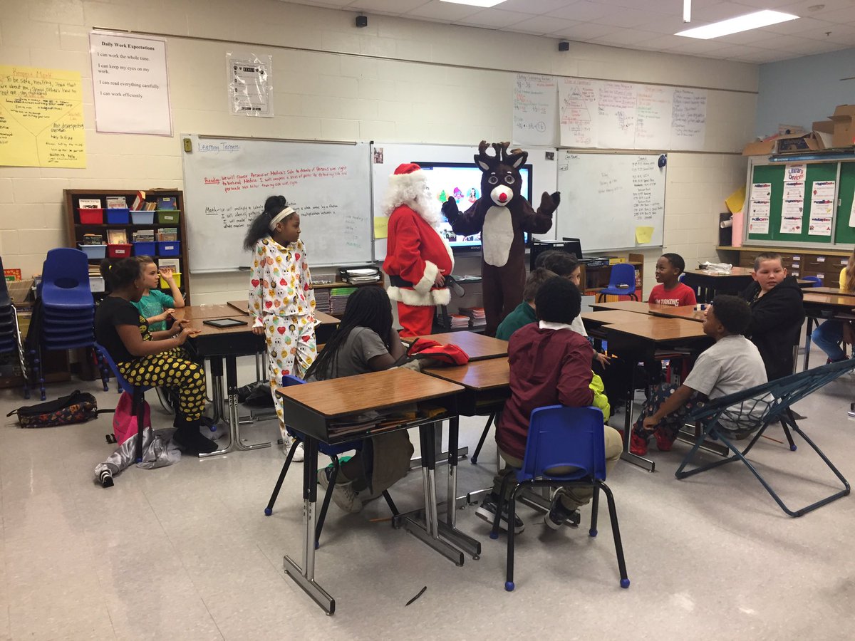 portlandjcps's tweet photo. Santa and Rudolph are here for Polar Express Day giving cookies and milk while distributing hats and gloves donated by #ElevatePortland @southeastchrist @UofLbiz @region6jcps https://t.co/OndhnlC1JD
