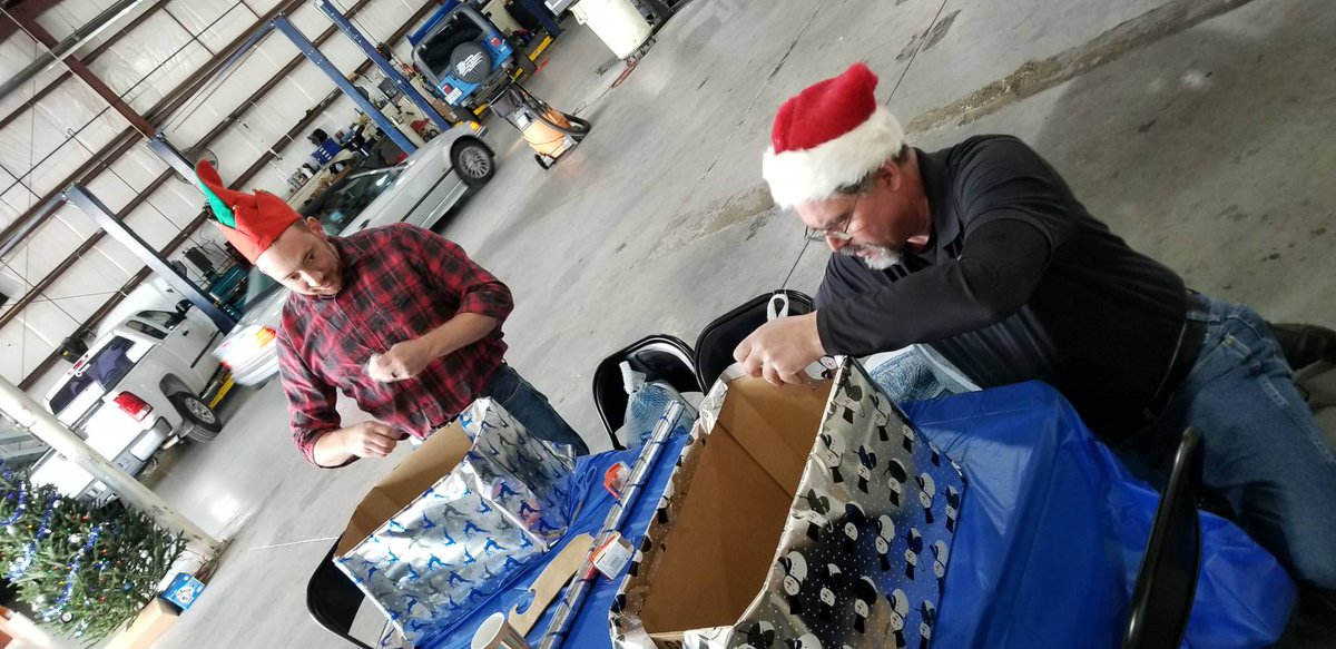 daviscarcare's tweet photo. The Christmas dinner gift box wrapping is underway! You could say things are getting a bit competitive... https://t.co/wPPPMXkhxT