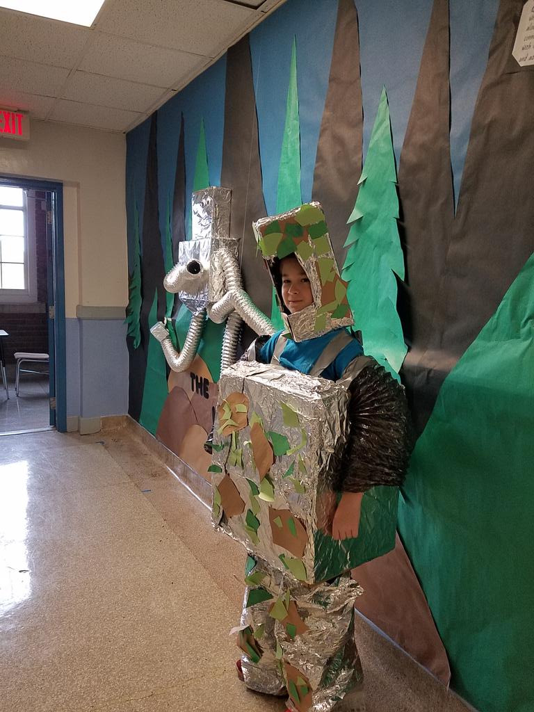 4thWiley's tweet photo. Student dresses as Roz in camouflage for  The Wild Robot,our global read aloud book!#WeAreWiley https://t.co/lUYYMqEL8K