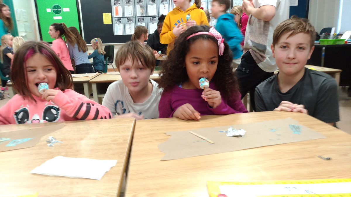 MrsColvinsClass's tweet image. Ms. Rosen and the Grade Seven students taught us about Hanukkah today. We made edible dreidels! @EmmaKingES