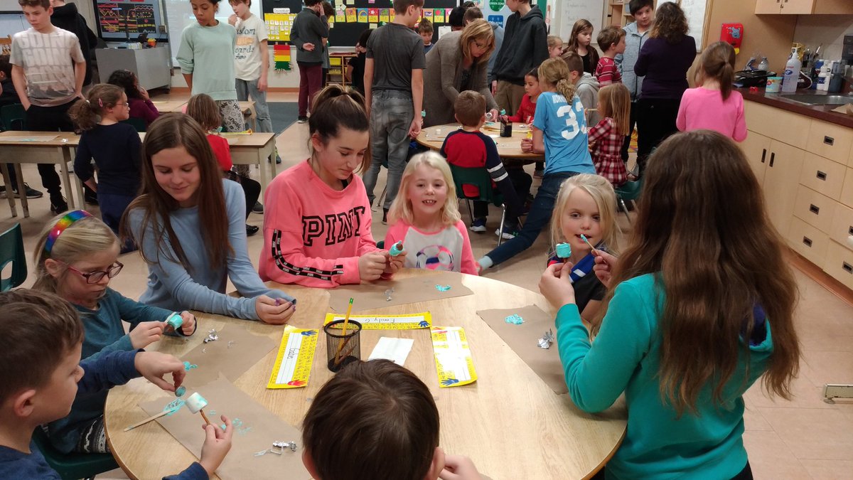 MrsColvinsClass's tweet image. Ms. Rosen and the Grade Seven students taught us about Hanukkah today. We made edible dreidels! @EmmaKingES