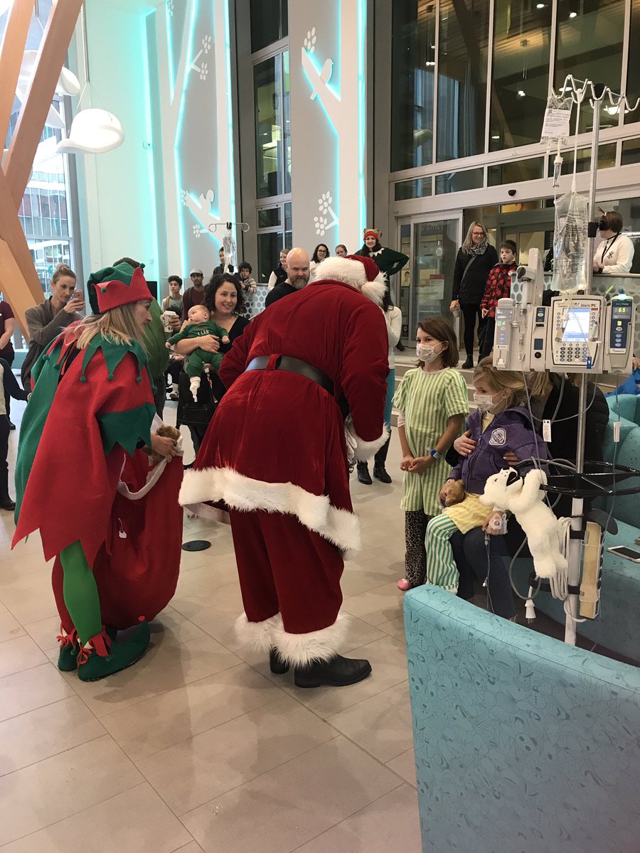 BC_EHS's tweet photo. Santa and his elf say hello to a very special young patient @BCChildrensHosp. #SantaFlightBC https://t.co/cXDBD5Hp6i