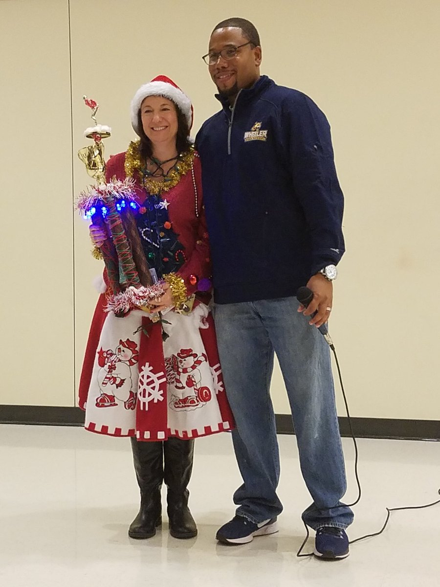 library_wheeler's tweet photo. Guess who won the ugly sweater contest? #UglySweaterDay #AwesomeParapro #CobbLMS https://t.co/sIfUlA9geb