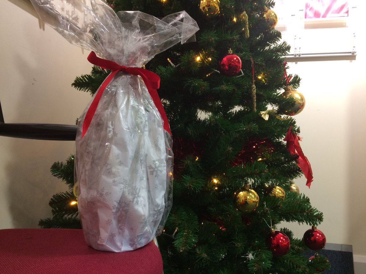 Wrapping tip from the pros <a href="/CreaseysGSY/">Creaseys</a> to use cellophane and tissue paper for those awkward shaped pressies. It looks a lot better than I'd have managed!