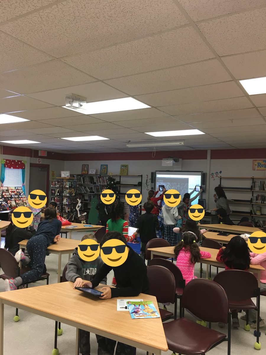 Grade 4s working hard on problem solving! Very cool to see QR codes and different forms of technology used in the classroom