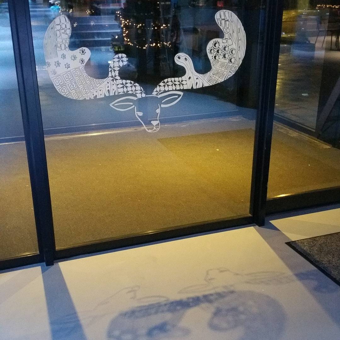 elinekatz's tweet photo. Illustration I made of deer with antlers on the glass entrance doors of @CKEeindhoven https://t.co/LrnIoTbUob