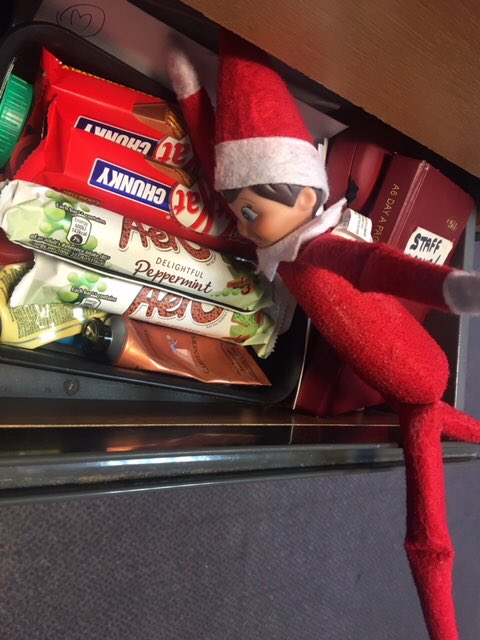 KidsIncUK's tweet photo. Cheeky elf #LarryLoughton has found the office chocolate stash! #greedyelf @nestle https://t.co/Fh48j5Pzyn