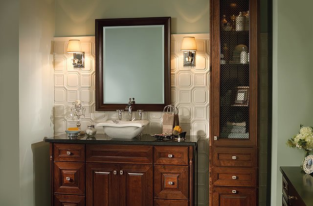 This vanity features the Merillat Masterpiece® Temora door style in a rich Cherry Kaffe stain. ow.ly/7teP30hewYx