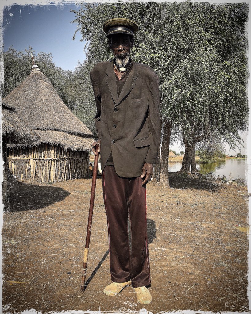 Riek Duor, more than 80 years old, along Pibor river, Upper Nile State, in opposition stronghold, #SouthSudan, proud of his cap worn since he was in Sudan army, before independence #postcard