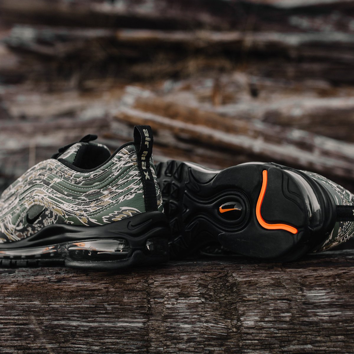 Notre's tweet photo. Nike Air Max 97 Camo. Featuring a camo pattern inspired by the armed services and a removable U.S.A. flag patch on the tongue. Releasing in-store and online Thursday 12/21 https://t.co/PbqrqU9GPm