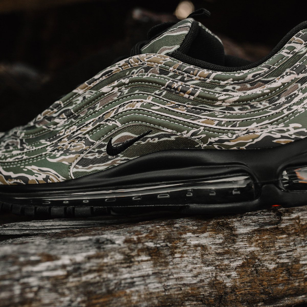 Notre's tweet photo. Nike Air Max 97 Camo. Featuring a camo pattern inspired by the armed services and a removable U.S.A. flag patch on the tongue. Releasing in-store and online Thursday 12/21 https://t.co/PbqrqU9GPm