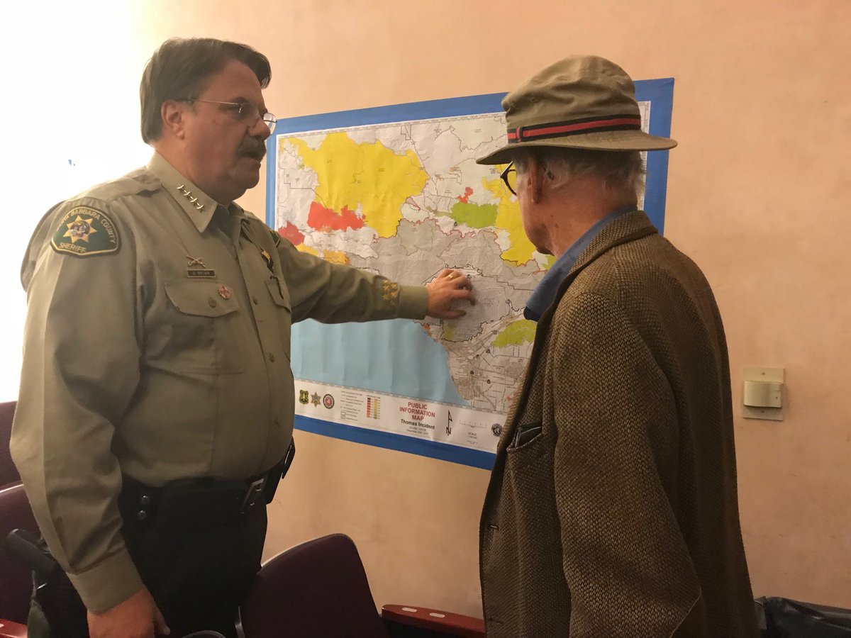 sbsheriff's tweet photo. Sheriff Brown answers questions from residents tonight. We are hoping the wind event tonight is uneventful and that we are able to get everyone back in their homes safely as soon as possible. Thanks for your continued patience. 
#sbsheriff #thomasfire https://t.co/Q0bz2vV0It