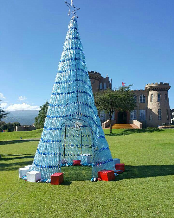 tafariacastle's tweet photo. This 25ft Xmas tree at Tafaria Castle is made using recycled plastic bottles by local artists - our small effort to #beatpolution as we transition to glass bottles. A pollution free Xmas, you are invited.. https://t.co/zYkuDYykIs