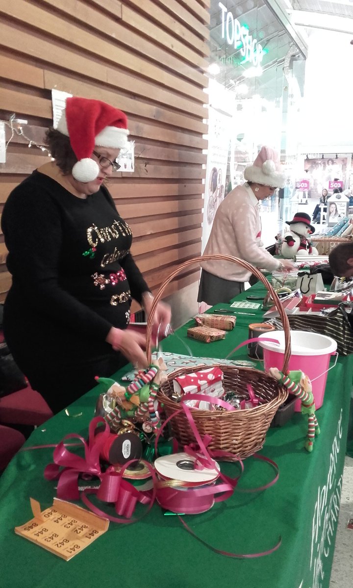 Volunteers from T-Systems hard at work on our Gift-Wrapping Stall in <a href="/FriarsSquare/">Friars Square</a>. Thanks ladies!