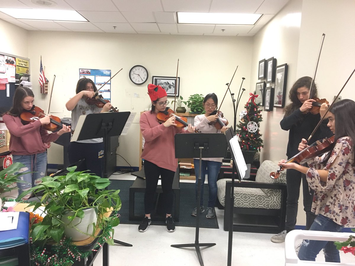 BHS String players performing for the Staff - Happy Holidays!