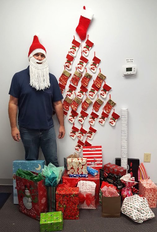 myprintsouth's tweet photo. Our stocking tree has presents! And a Santa! #printsouthcarolina #officesanta #Christmas #WhiteElephant https://t.co/sZH78tMcW2
