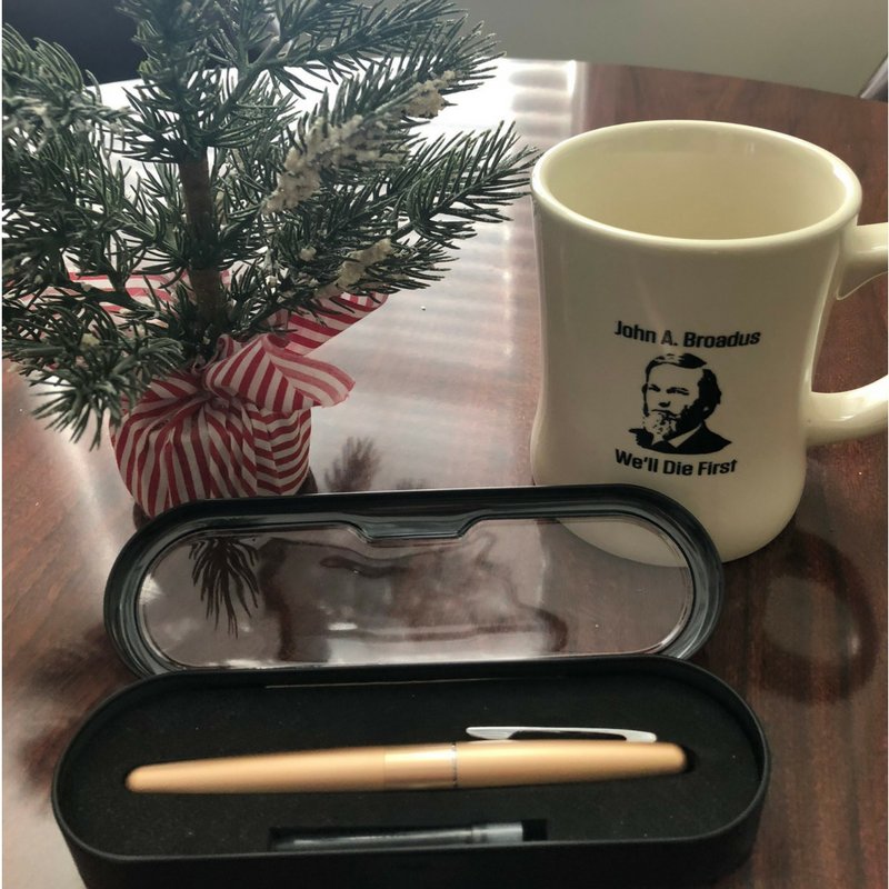 SBTSadmissions's tweet photo. Day 11 of #SBTSChristmas brings you a chance to win a John A. Broadus "we'll die first" coffee mug, and a great fountain pen! RT and follow to enter! https://t.co/8CoJIwUenv