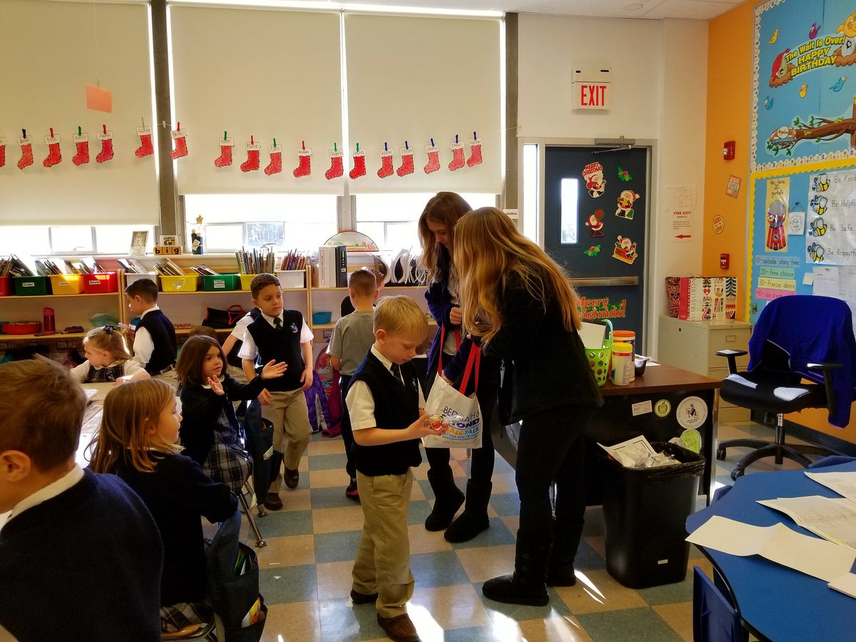 OLMA_NJ's tweet photo. Two OLMA Interact Club officers spent part of their day off giving away reindeer food to the Preschool and Kindergarton students at St. Mary School!  Wishing you all a magical Christmas! #reindeerfood #OLMAINTERACT https://t.co/IEAlWo4FQs