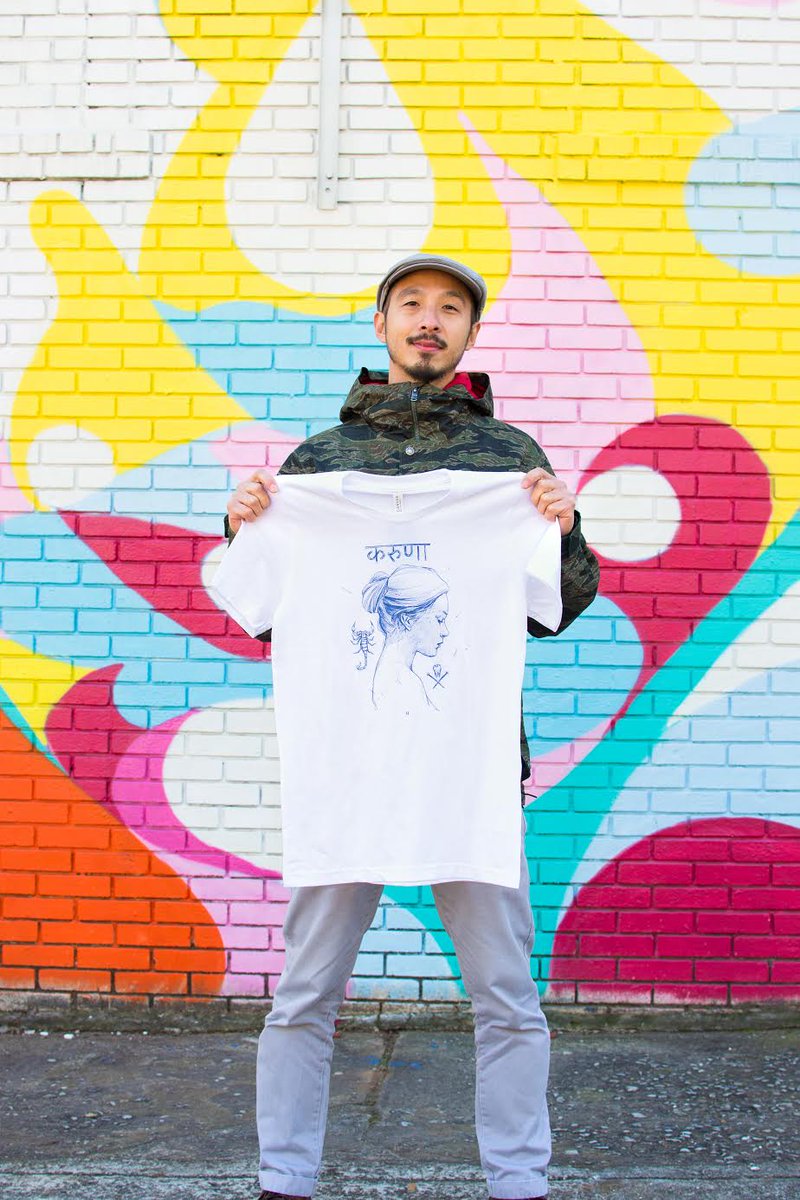 "It's #Giveaway time!! We're very excited to announce our 2nd collaboration for our gARmenT Project with Atlanta artist <a href="/sanithna/">Sanithna</a> and have decided to giveaway 20 shirts with his original art "Karuna"! Head to our Instagram to see how to enter!