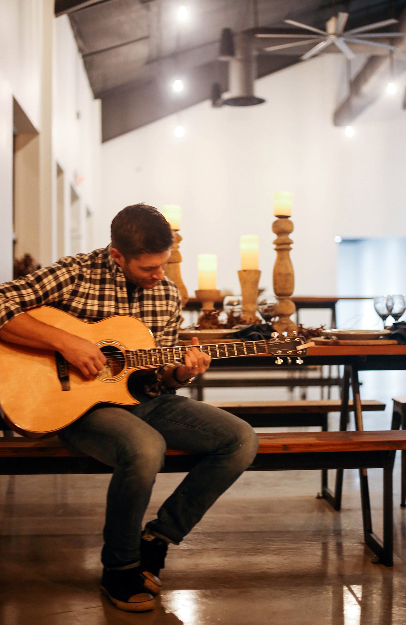 Jensen Ackles plays guitar at the Family Business Beer Company