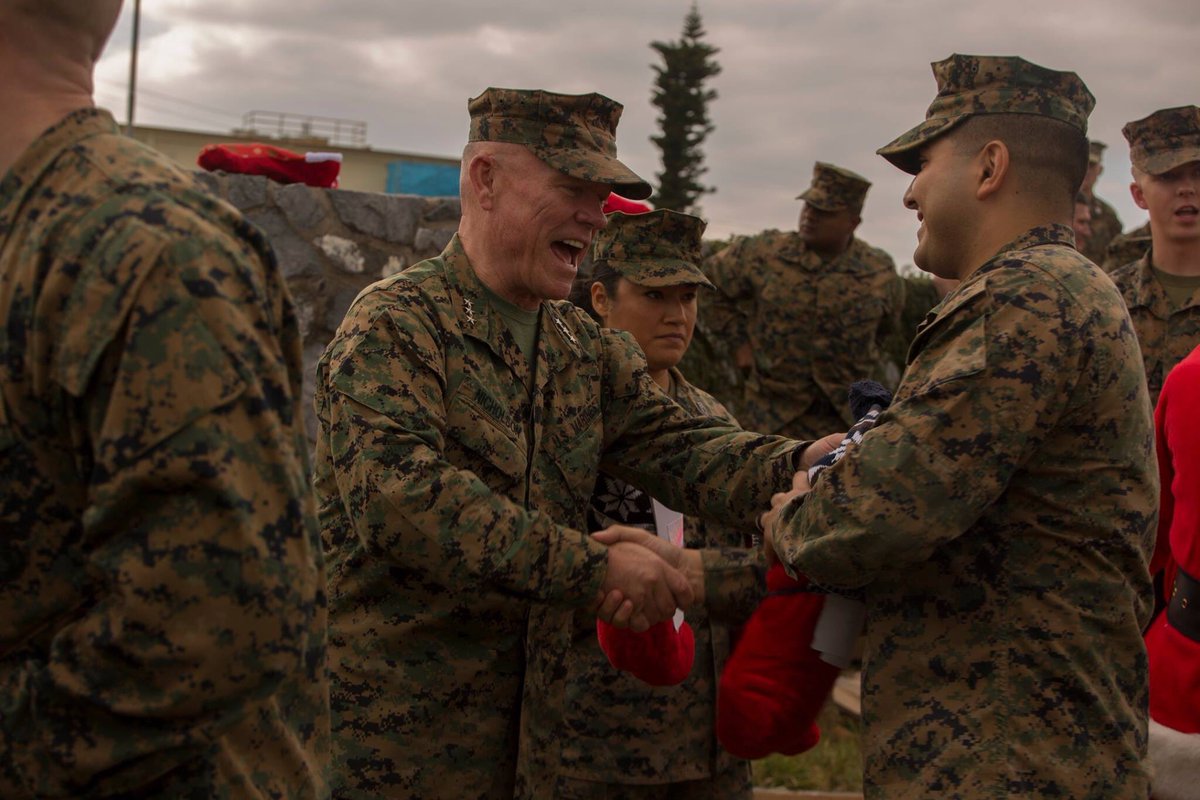 Santa Claus arrives!

III MEF Commander Lt. Gen. Lawrence D. Nicholson, alongside Santa Claus, handed out stockings donated from volunteer organizations and wished the Marines happy holidays and a Merry Christmas.