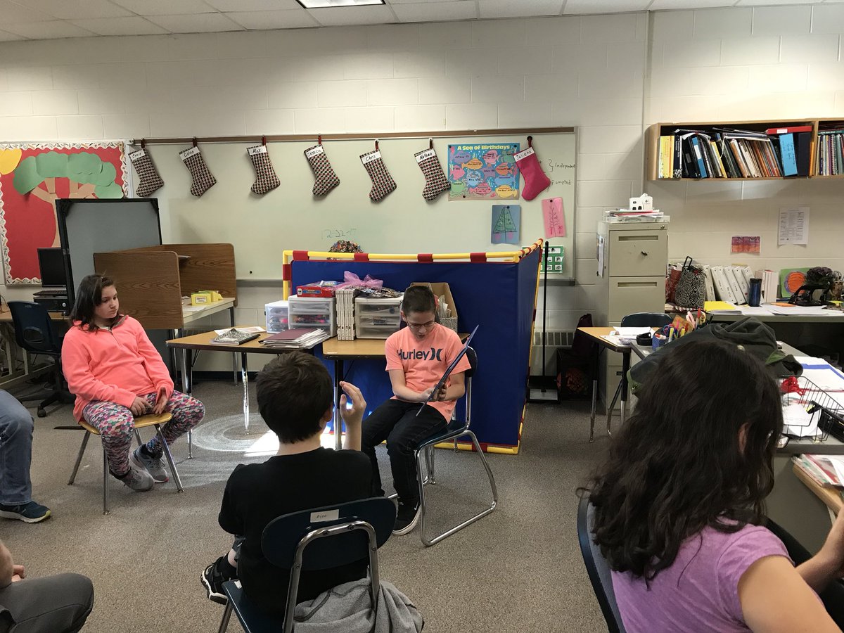 cmsreach's tweet photo. Former CMS students visiting and reading a holiday story to the REACH program students @cms_grizzlies https://t.co/Y65q6DnTpm