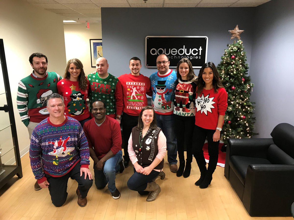 Happy Holidays from the AQ Crew and our loveliest sweaters! #UglySweaterDay #AQCrew