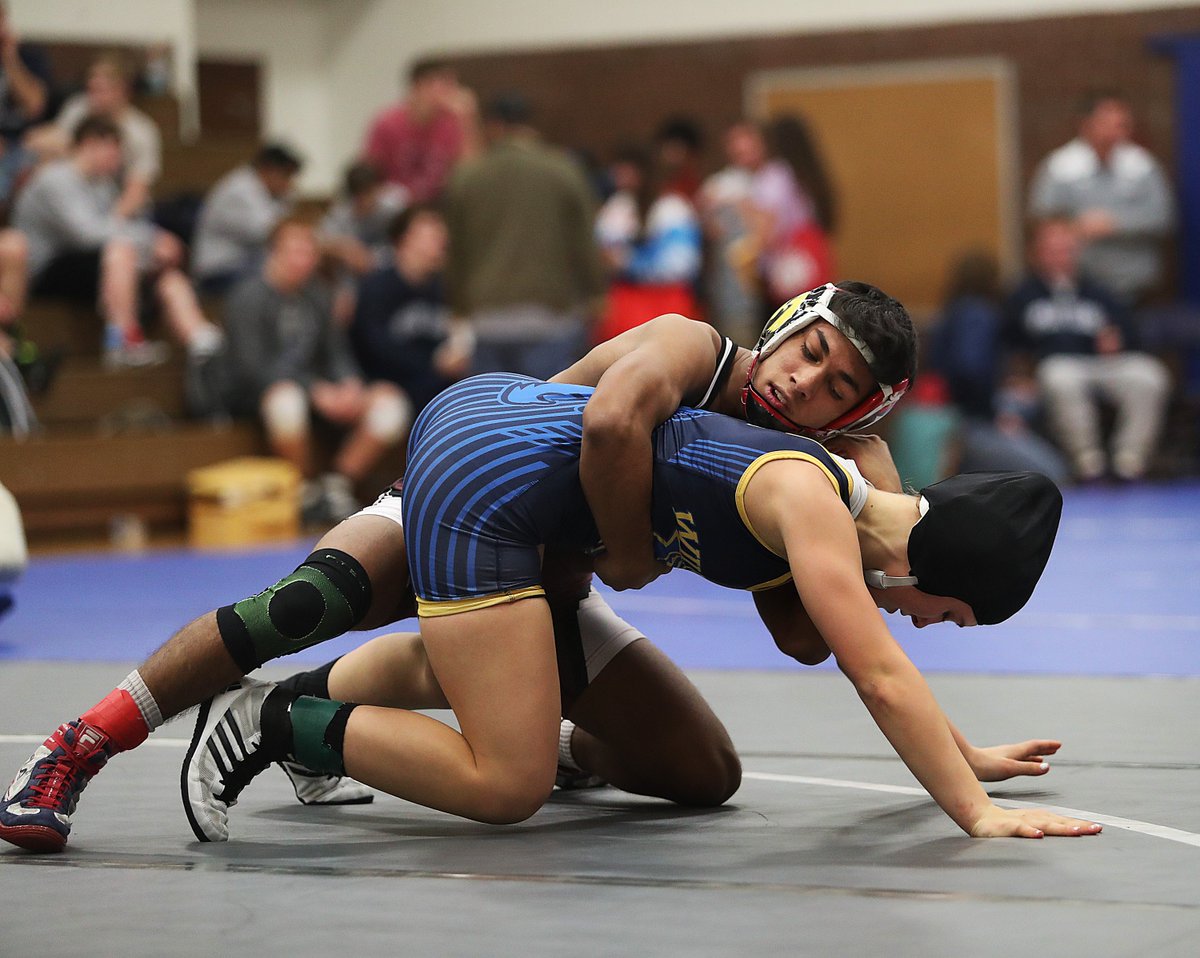 jeffcook58's tweet photo. Davenport North wrestler Tateum Park greets her 1-year-old cousin Willow, then meets her prom date, Moline's Isaiah Tapia in a 113-pound match  during the Rock Valley Muddy Waters Duals at North High School in Davenport, Iowa. https://t.co/jKasOKtuRK