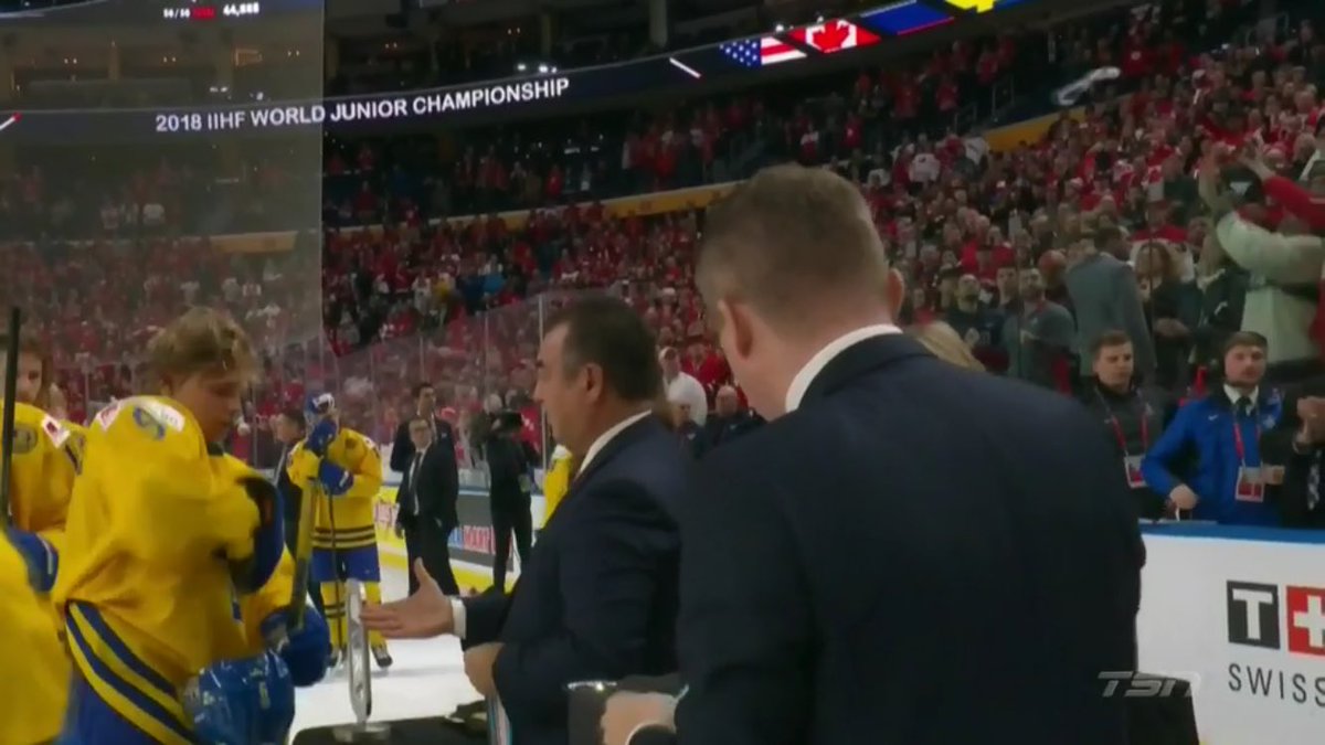 TSNHockey's tweet photo. WATCH: Team Sweden 🇸🇪 captain and #NYRangers prospect Lias Andersson tosses his #WorldJuniors silver medal into the crowd https://t.co/LO7QQCRoAt #TSNHockey https://t.co/AQ5LuXBtt4