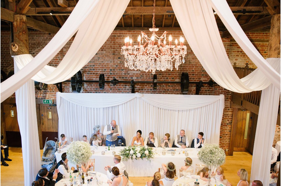 SPEECHES and a stunning photo from the mezzanine to capture the moment and memories. Image by Ilaria Petrucci Photography. Styling by <a href="/Medit_Occasions/">Venue Stylists</a> Flowers by @lukeandlottie17 #wedding #gaynespark #essex #barnwedding