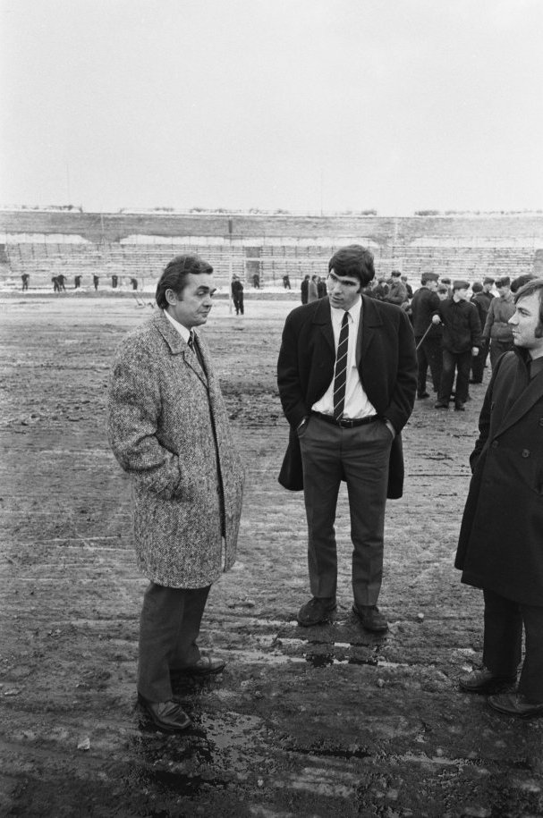Feyenoord's Ernst Happel &amp; Vim Van Hanegem inspect a snowy Walter-Ulbricht Stadion pitch in East Berlin before their European Cup Quarter Final tie with Vorwärts.
