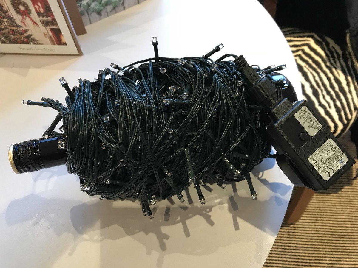 TimsNotWriting's tweet photo. What says ‘End of Christmas’ more than your discarded lights wrapped patiently around an empty Baileys bottle, waiting for next time? 

#ByeByeSanta https://t.co/JtvIuAsEk4