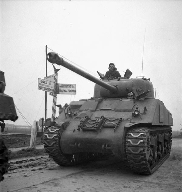 CanadasMilHist's tweet photo. A Sherman Firefly tank of the Fort Garry Horse near the Beveland Canal, Netherlands, ca. 29 Oct. 1944 https://t.co/vcDLotrk0L