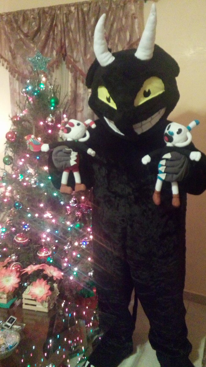 plushiewizard's tweet photo. So My friend David ordered Cuphead plushies from me a few months back to go with his devil costume. I told him if he ever did a photo shoot to send me pics. So I got this on Christmas Eve. Pretty sure he won Christmas. #CupHead #cosplaywin https://t.co/yNyp3cTl3A