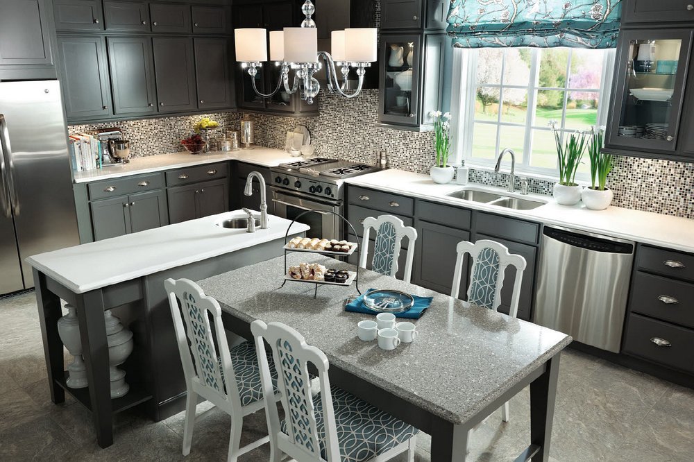 Grey kitchens continue to grow in popularity. This kitchen features the Merillat Masterpiece® Harmond door style in a Greyloft painted finish. ow.ly/SYM930hexaS