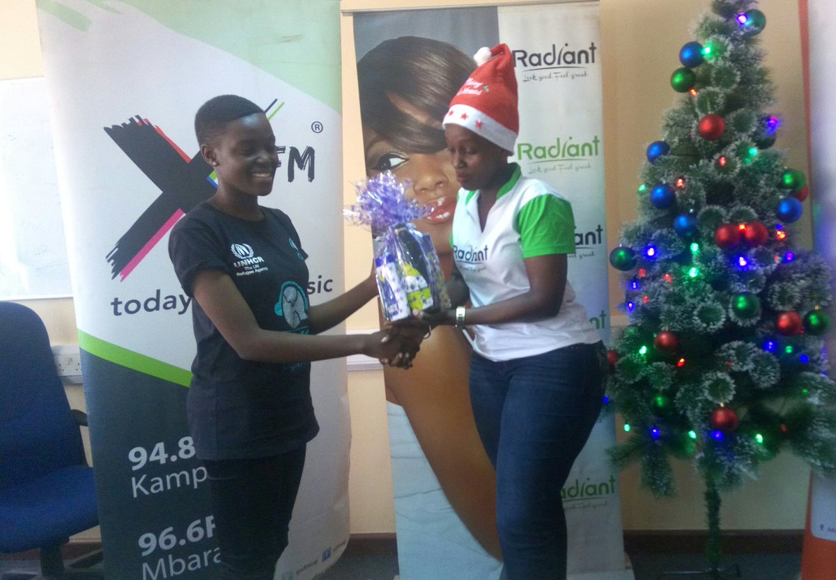 XfmUG's tweet photo. Viola, brand manager @radiantcos hands over a cosmetics hamper to Bravery one of our daily winners of the #XFmLitMas promotion
A big thank you to our partners @africellUG @roundbob1 & @radiantcos
CC. @libolo_chaii @kanyindo @DenzelUG @rudende @LynnUg3 @MR_SKILLZ256 https://t.co/mJmjpnukLV