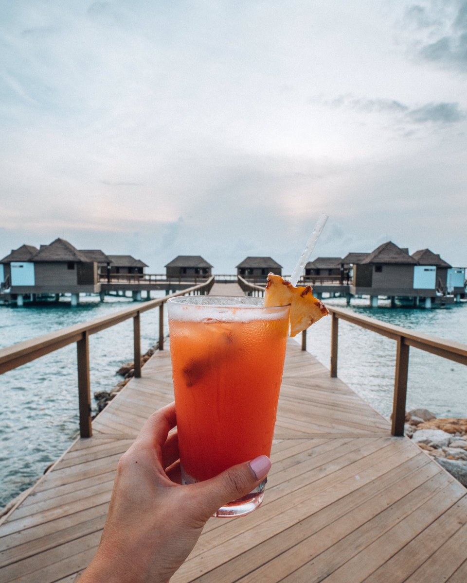 Travel blogger <a href="/tourdelust/">Tour de Lust</a> enjoys a refreshing, fruity Scotch cocktail in this perfect paradise setting. #LoveScotch #ScotchWithAView
