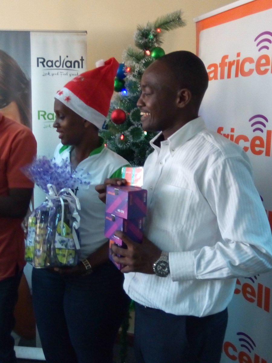 africellUG's tweet photo. Our PRO @EdgarKaramagi and Social Media Manager @oworugambo hand over prizes to #XFmLitMas winners. https://t.co/fMEc8slvSV
