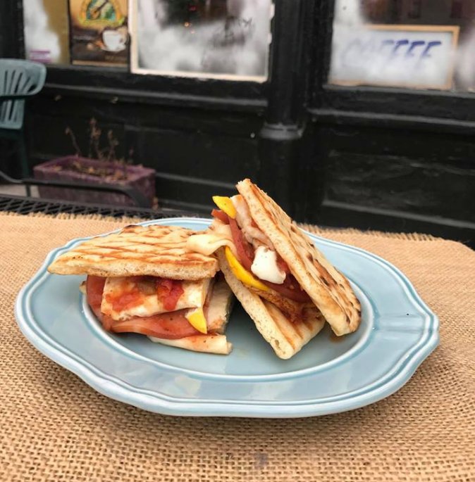 PLCoffeehouse's tweet photo. If you haven't tried our new sammich --The Rudolph -- yet, stop what you're doing and get here NOW to sink your teeth into this pile of deliciousness, loaded with Canadian Bacon, Fresh Fried Eggs, Swiss Cheese, Smothered with Organic Salsa and Pressed flat on Naan Bread! https://t.co/V7XqGFmu0L