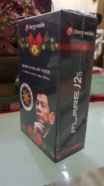 PhilippineStar's tweet photo. LOOK: Personalized Cherry Mobile phones with President Rody Duterte on the packaging were distributed as a Christmas gift from Malacañang. https://t.co/8PRnw3Vi7C