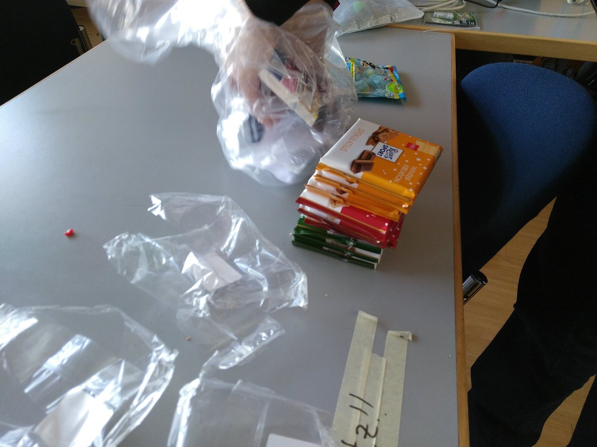 An angel unpacking chocolate from a plastic bag