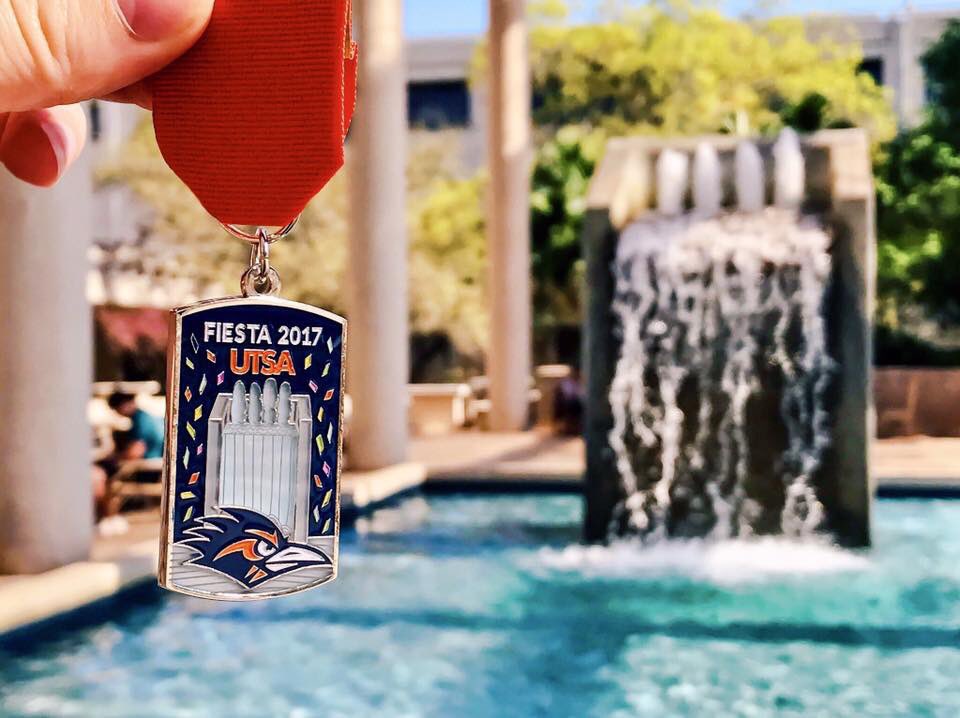 UTSA's tweet photo. Medal mania broke our top five favorites of the year. Coming in at No. 3: Sombrilla Fountain makes its way onto the UTSA Fiesta medal. #UTSA #VivaFiesta #FiestaUTSA #Best2017Posts https://t.co/1O7NhmDHUP